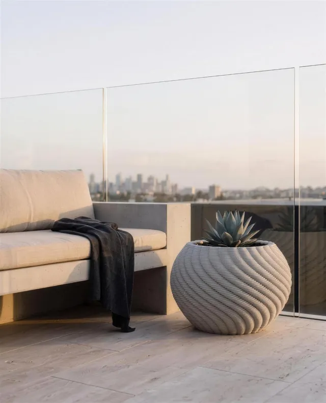WAVE .02 spherical printed concrete planter with spiral ribs
