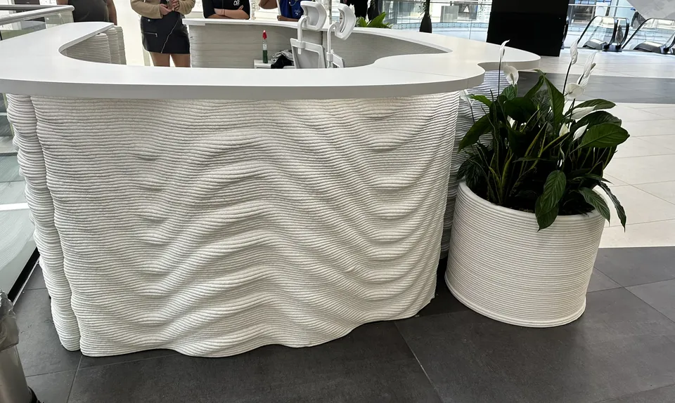 Info desk with wave texture and planters