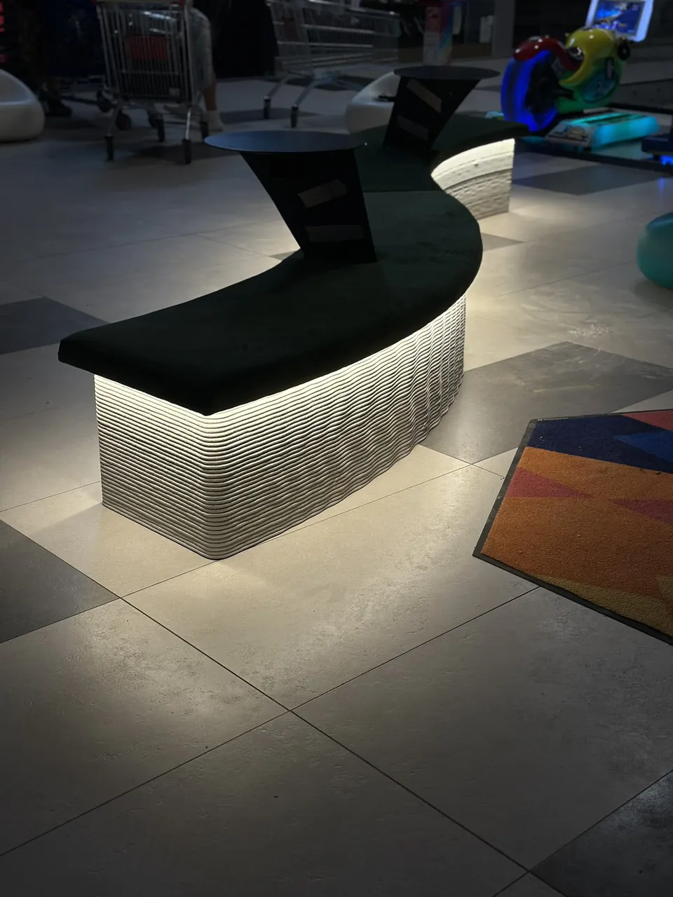 Winding printed bench with a lit base, seen from above
