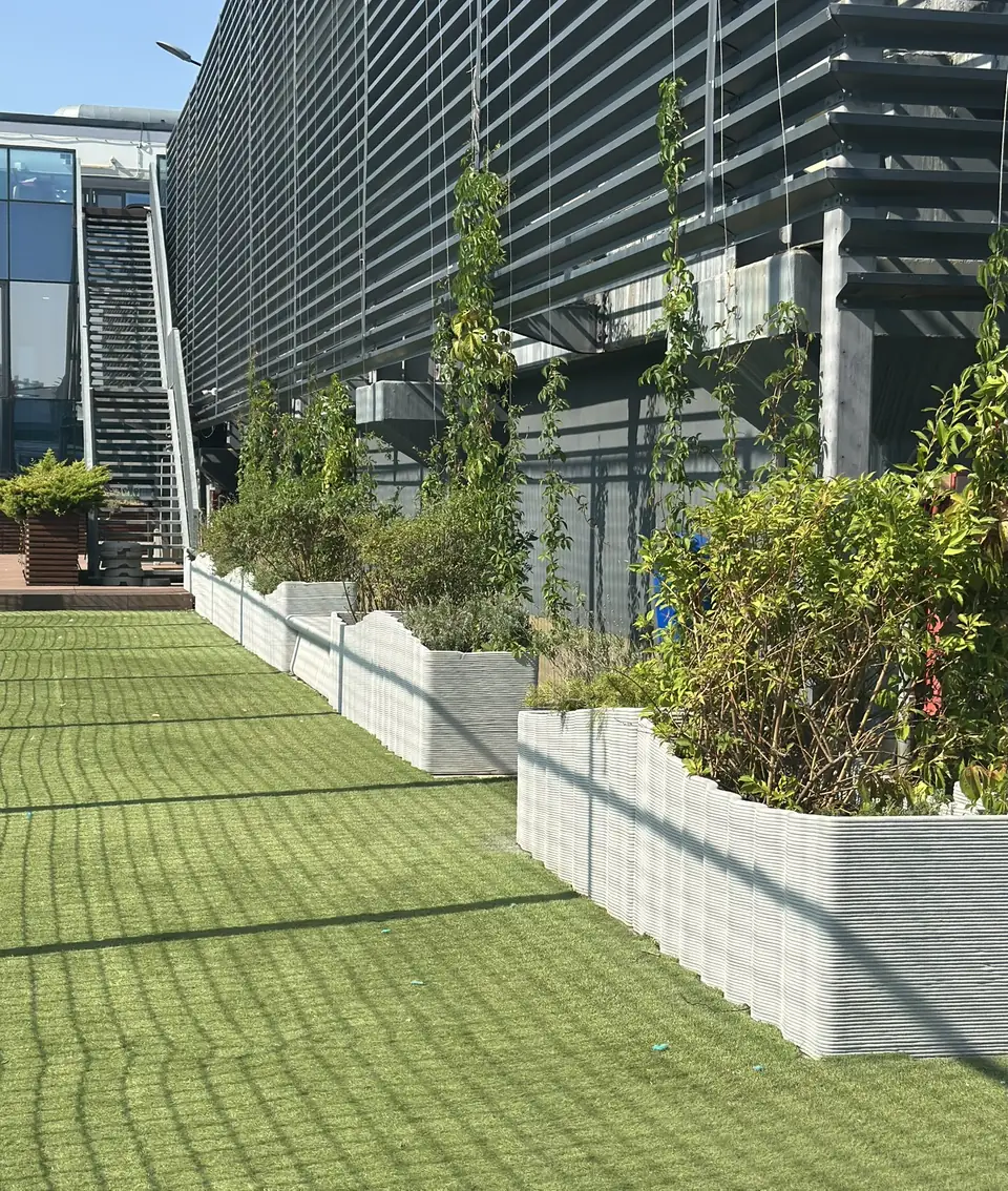 Planters along the façade of the terrace
