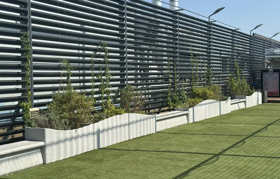 The long run of planters and benches